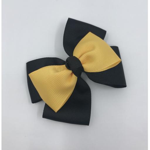 Black Double Layer Bow with Yellow Gold Single Top Layer and Top Knot on Clip